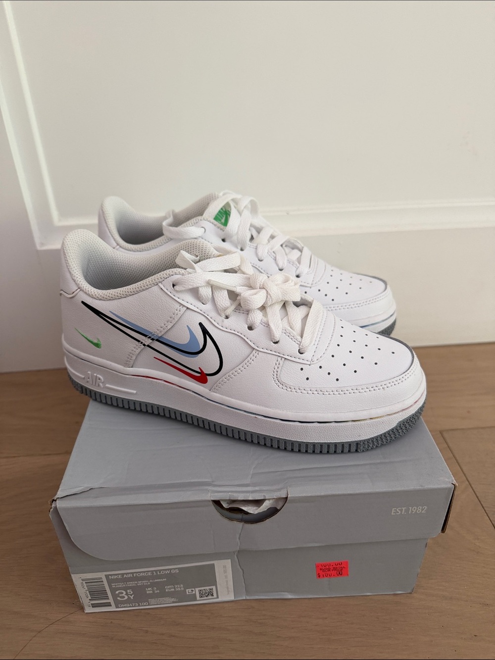 Nike Air Force White Low-Top Sneakers with Multi-Color Swoosh